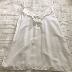 Off white sleeveless top, with crochet details